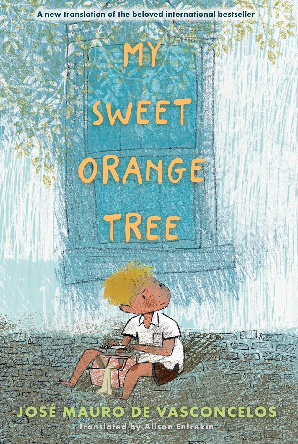 Cover for My Sweet Orange Tree featuring an illustration of a young boy with blonde hair sitting on the ground made of brick or cobble beside a window of a building with a toolbox at his feet looking off to the side. The window is blue and the leaves of a tree cover a corner of it.