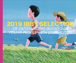 Hero image for Outstanding Books for Young People with Disabilities featuring an illustration of two asian children running through a grass field with the ocean in the background and the text "2019 IBBY Selection of Outstanding Books for Young People with Disabilities" overlaying it in yellow and white as well as a pink rectangle lining the left side of the image.