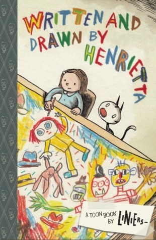 Cover for Written and Drawn by Henrietta featuring an illustration of a young girl at a table with a cat looking up at her from behind her while she draws crayon-like cartoonish drawings on a giant piece of paper. The book's title is also stylized like a child's crayon drawing.