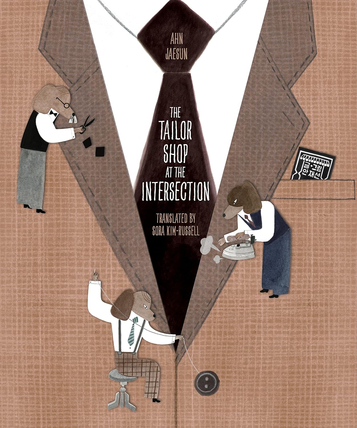 Cover for The Tailor Shop at the Intersection featuring a collage and illustrations depicting three smaller dog people sewing, ironing and cutting a brown suit which takes up the entire cover.