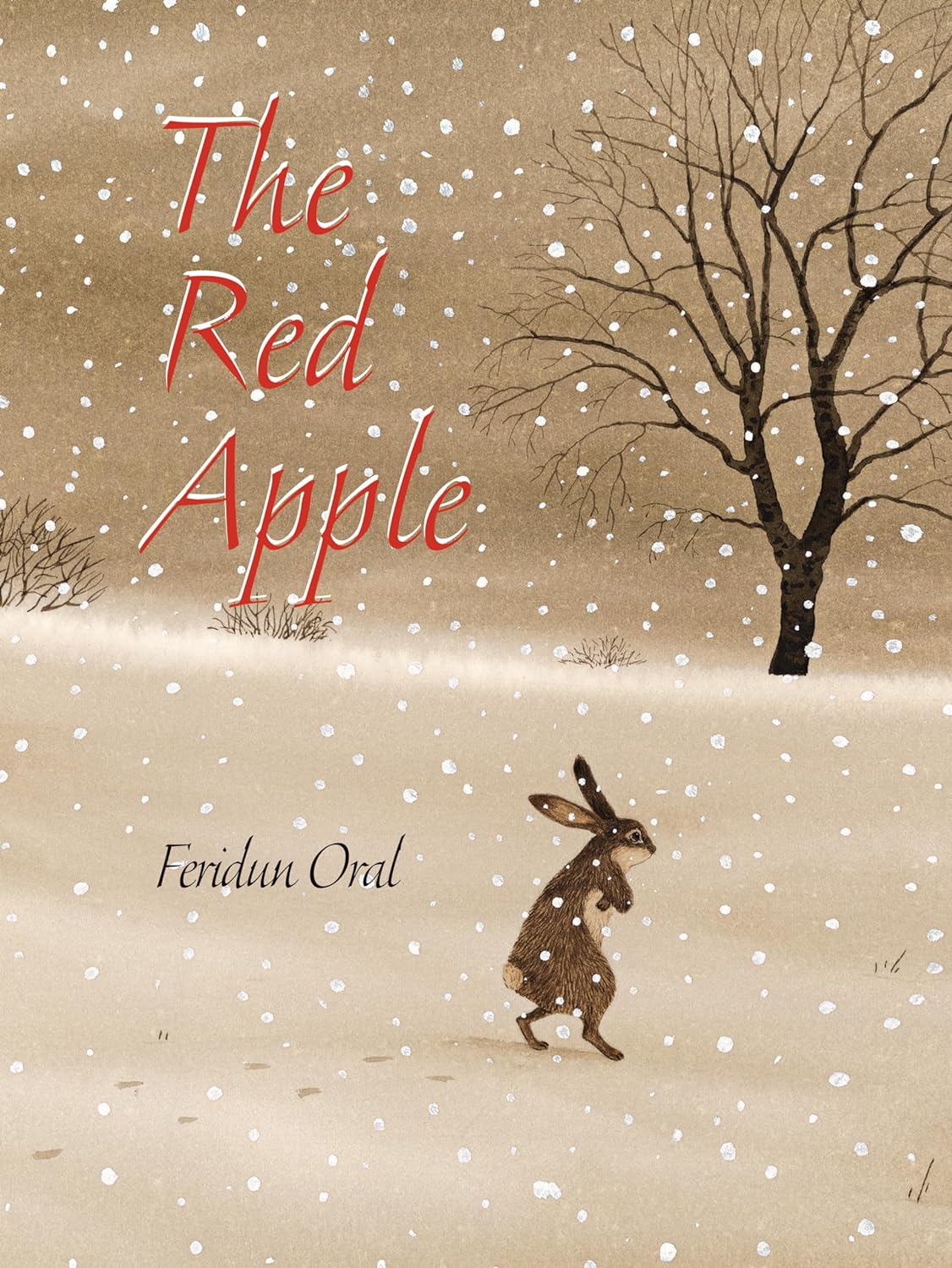 Cover for The Red Apple featuring a rabbit with his arms crossed and appearing cold walking through a dreary beige snowy landscape with footsteps trailing him in the snow. The bright red title with white accents contrasts with the beige background.