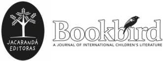 Post image for Bookbird: A Journal of International Children's Literature featuring the journal's title logo with the word 'Bookbird' in large outlined type with a crow on top of it to the right and a black emblem to the left with a graphic of a tree in white inside of it with the text "Jacarandá Editoras".