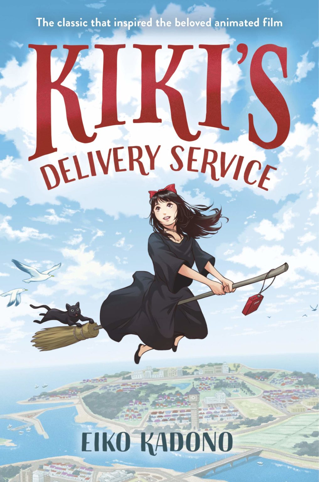 Cover for Kiki's Delivery Service featuring an illustration of a young woman in a black dress with a red bow on her hair who is a witch on a broomstick in the sky with a black cat hanging off the end holding on as if it's about to fall and a red purse hanging off the tip of the broomstick's handle. In the background is a view of the landscape from above like you might see from an airplane. The cover's title is displayed in dark red.