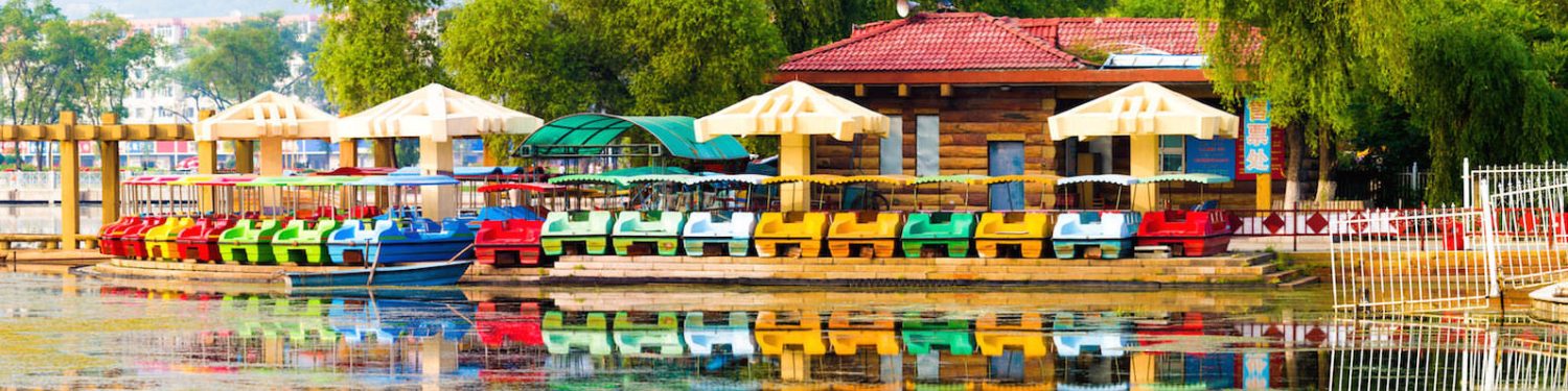 Post image for Words Without Borders Campus featuring a photo of a place to rent pedal boats on a body of water in China.