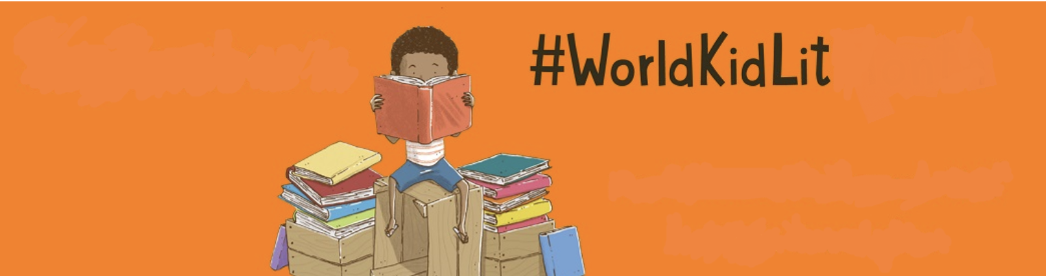 Post image for World Kid Lite featuring an illustration of a kid sitting on a milk crate reading a book with crates filled with books on either side of him on a bright orange background. In black letters the text "#WorldKidLit" hovers to the right.